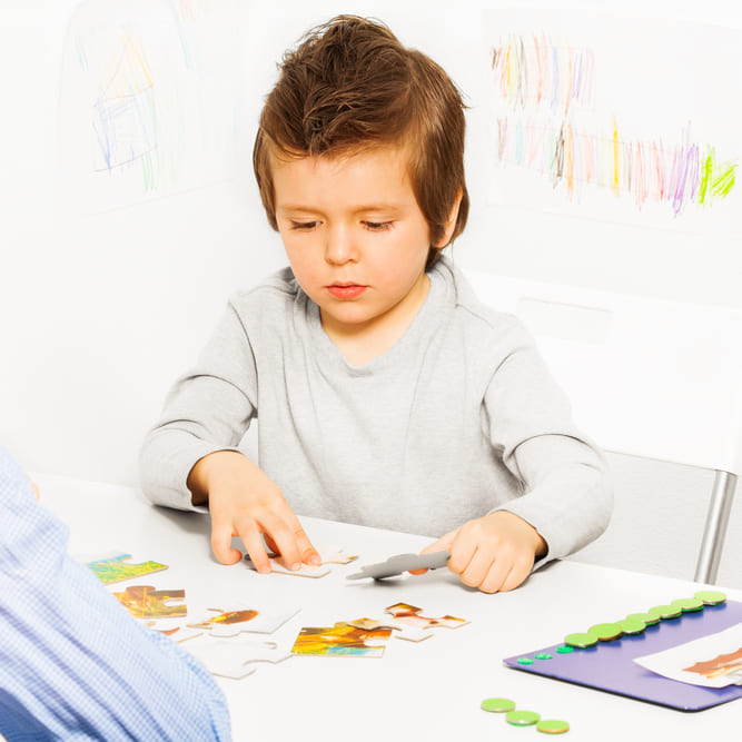 Boys doing card activities - Applied Behavior Analysis Achievement Balance