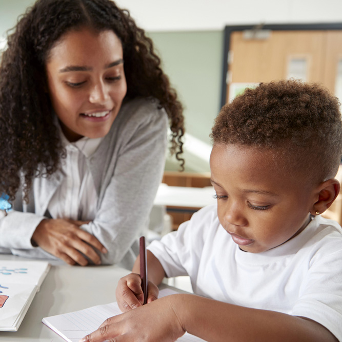 woman teacher with curly hair in kindergarten