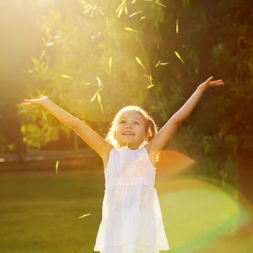 Girl playing in the sun