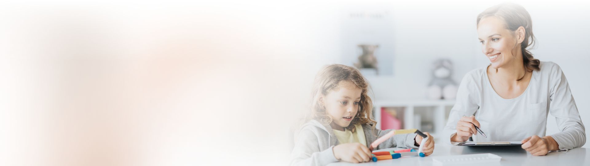 Young boy playing during psychotherapy with psychologist