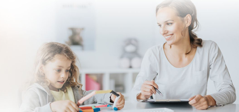 Young boy playing during psychotherapy with psychologist