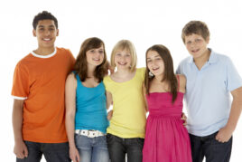 Teens with autism engaging in a guided social group activity, building peer connections with support from an Achievement Balance therapist.
